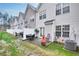 Townhouse backyard features patio, seating, privacy fence, and well-maintained lawn at 6730 Gallant Se Ct, Mableton, GA 30126