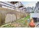 Small backyard with outdoor seating and a retaining wall, creating a private and functional outdoor space at 6730 Gallant Se Ct, Mableton, GA 30126