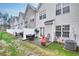 View of a tidy backyard, enhanced with patio furniture and a privacy fence at 6730 Gallant Se Ct, Mableton, GA 30126