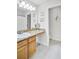 Bathroom featuring a granite countertop, neutral tile, and plenty of open space at 6730 Gallant Se Ct, Mableton, GA 30126