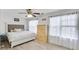 Bright bedroom features hardwood floors, a large window, and a decorative headboard at 6730 Gallant Se Ct, Mableton, GA 30126