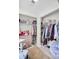 Walk-in closet with ample shelving, hanging space, and a cozy sitting area at 6730 Gallant Se Ct, Mableton, GA 30126