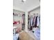 Walk-in closet featuring built-in shelving, ample storage space, and a well-organized layout at 6730 Gallant Se Ct, Mableton, GA 30126
