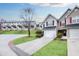 Charming townhome with a one-car garage, a manicured lawn, and a paved driveway at 6730 Gallant Se Ct, Mableton, GA 30126