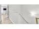 Hallway with light hardwood floors, leading to rooms with natural lighting at 6730 Gallant Se Ct, Mableton, GA 30126