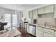 Bright kitchen with stainless steel appliances, granite countertops, and eat-in dining area at 6730 Gallant Se Ct, Mableton, GA 30126