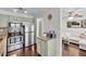 Open kitchen with stainless steel appliances, granite counters, breakfast bar, and access to the living room at 6730 Gallant Se Ct, Mableton, GA 30126