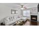 Cozy living room with a plush sectional sofa and fireplace at 6730 Gallant Se Ct, Mableton, GA 30126