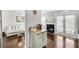 Open floor plan featuring a kitchen island, a living room and a fireplace at 6730 Gallant Se Ct, Mableton, GA 30126