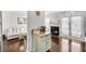 Open-concept living area features fireplace and French doors leading to the patio, plus a modern dining area at 6730 Gallant Se Ct, Mableton, GA 30126