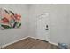 Entryway features luxury vinyl plank flooring, an exterior door with glass, and a large painting at 6971 Tan Bark Ct, Riverdale, GA 30296