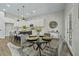 Eat-in kitchen featuring stainless appliances, white cabinets and a stylish island with seating at 6971 Tan Bark Ct, Riverdale, GA 30296