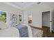 Bright, spacious main bedroom with ensuite bathroom, hardwood floors, and tray ceiling at 6971 Tan Bark Ct, Riverdale, GA 30296