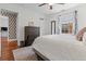 Cozy bedroom with an area rug, dark wood dresser, and access to a laundry area at 733 Rice Nw St, Atlanta, GA 30318