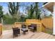 Spacious wooden deck with outdoor furniture and wood railing with access to a fenced yard at 733 Rice Nw St, Atlanta, GA 30318