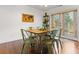 Inviting dining area with hardwood floors, modern furniture, and a bright atmosphere at 733 Rice Nw St, Atlanta, GA 30318