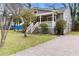 Exterior of home with a covered porch and well maintained lawn at 733 Rice Nw St, Atlanta, GA 30318
