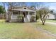 Charming bungalow-style home with inviting front porch and meticulously manicured landscaping at 733 Rice Nw St, Atlanta, GA 30318