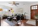Bright living room with hardwood floors, a ceiling fan, and stylish contemporary decor at 733 Rice Nw St, Atlanta, GA 30318