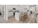 Bright kitchen featuring an island with seating, stainless steel appliances, and modern white cabinetry at 1235 Cedarcrest Blvd, Acworth, GA 30101