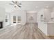 Bright open concept living space featuring wood-look floors and a fireplace at 1235 Cedarcrest Blvd, Acworth, GA 30101