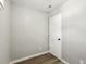 A small, empty room with hardwood floors and light gray walls, creating a minimalist and modern feel at 1406 Kennesaw Nw Dr, Atlanta, GA 30318