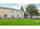 Spacious backyard featuring green lawn and mature trees, perfect for outdoor activities and relaxation at 1624 River Main Ct, Lawrenceville, GA 30046