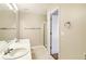 Bright bathroom featuring a double vanity, neutral color palette, and a shower with glass door at 1624 River Main Ct, Lawrenceville, GA 30046
