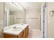 Well-lit bathroom with double sinks, lots of mirror space, and a shower stall at 1624 River Main Ct, Lawrenceville, GA 30046