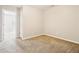 Simple bedroom features neutral walls and carpet at 1624 River Main Ct, Lawrenceville, GA 30046