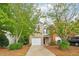 Inviting two-story house with well-maintained front yard, brick facade, and attached garage at 1624 River Main Ct, Lawrenceville, GA 30046
