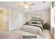 Staged bedroom featuring a queen bed and decor for marketing appeal at 1624 River Main Ct, Lawrenceville, GA 30046