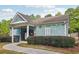 Community pool house with light blue siding, white trim, and lush landscaping at 1624 River Main Ct, Lawrenceville, GA 30046