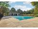 Community pool area featuring a covered pool and an adjacent pool house at 1624 River Main Ct, Lawrenceville, GA 30046