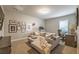 Well-lit living room with sofa, workspace, and decorative art at 1384 Doublegate Dr, Brookhaven, GA 30319