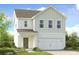 Charming two-story home with white siding, a two-car garage, and a well-maintained front yard at 207 Groveton Ct, Euharlee, GA 30145