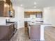 Bright and open kitchen with an island, stainless appliances, and hard surface countertops at 207 Groveton Ct, Euharlee, GA 30145