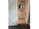 Modern bathroom features a white vanity, a large mirror and updated fixtures at 2405 Cross Nw St, Atlanta, GA 30318