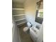 This bathroom features a window, shelves and sink at 2405 Cross Nw St, Atlanta, GA 30318