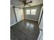 This bedroom features a ceiling fan, barn doors, and updated flooring throughout the comfortable space at 2405 Cross Nw St, Atlanta, GA 30318