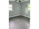 Corner bedroom with freshly painted interior, vinyl flooring and lots of natural light at 2405 Cross Nw St, Atlanta, GA 30318