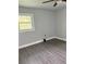 Bedroom offering a ceiling fan, wood look vinyl floors, and a freshly painted interior at 2405 Cross Nw St, Atlanta, GA 30318
