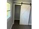 Modern interior featuring a sliding barn door to a closet area at 2405 Cross Nw St, Atlanta, GA 30318