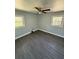This bedroom features a ceiling fan, windows, and neutral paint at 2405 Cross Nw St, Atlanta, GA 30318