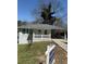 Charming single-story home with grey brick, covered parking, and a well-maintained front yard at 2405 Cross Nw St, Atlanta, GA 30318