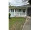 Charming bungalow-style home with freshly painted gray brick and a welcoming covered front porch at 2405 Cross Nw St, Atlanta, GA 30318