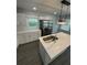 Kitchen features a modern island, stainless steel refrigerator, and sleek countertops at 2405 Cross Nw St, Atlanta, GA 30318