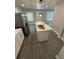 Kitchen island with stainless steel sink and modern faucet under a stylish pendant light at 2405 Cross Nw St, Atlanta, GA 30318