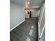 Bright and spacious living area features modern flooring, recessed lighting, and an open concept to the updated kitchen at 2405 Cross Nw St, Atlanta, GA 30318