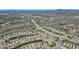 An aerial view shows a sprawling community with homes, roads, and trees in a picturesque landscape at 5470 Beaver Ridge Dr, Cumming, GA 30040